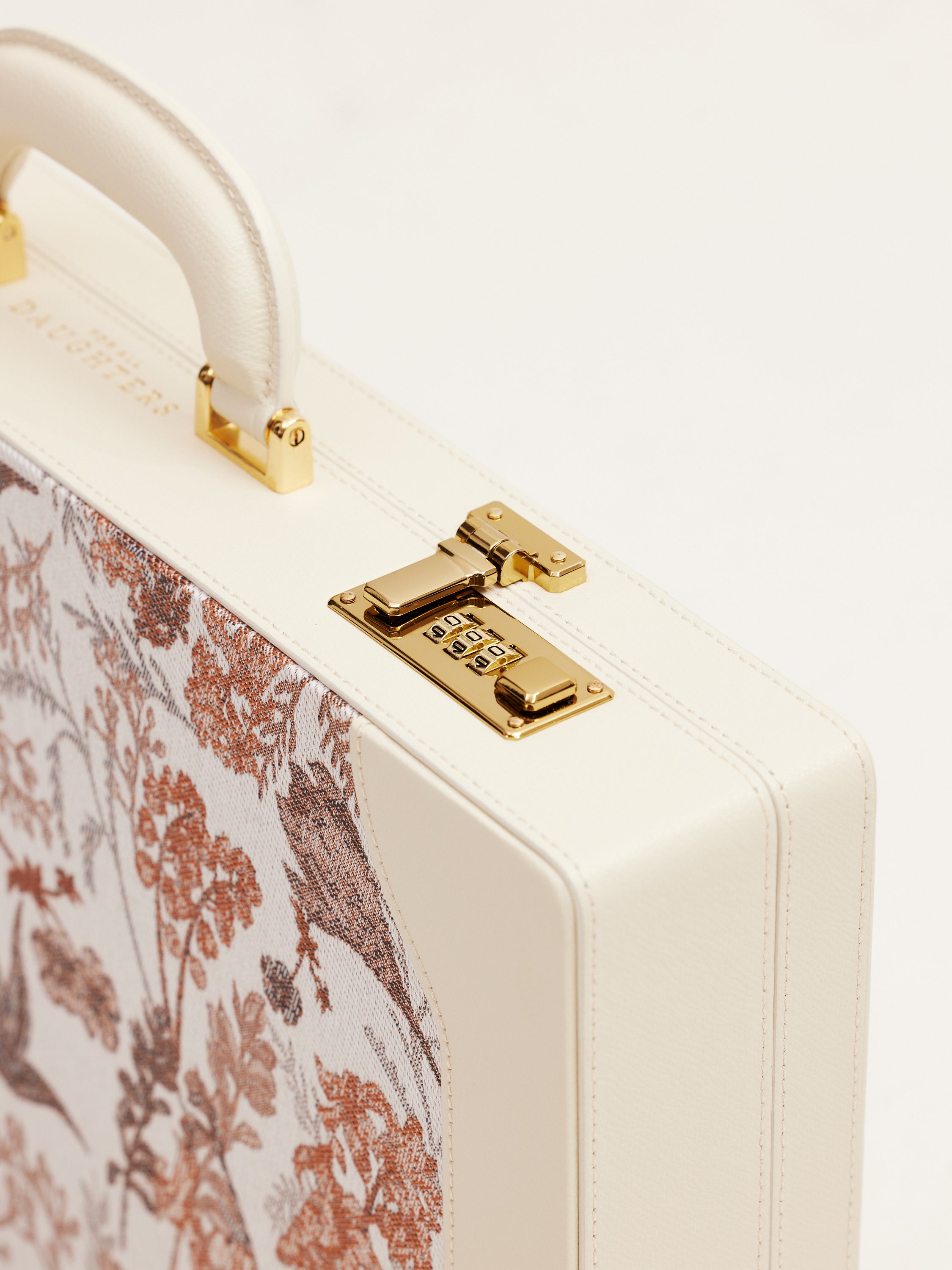 Handle view of For All Daughters Latte Heritage Briefcase with gold detail — handcrafted between Ireland and Italy, a refined luxury gift for modern women