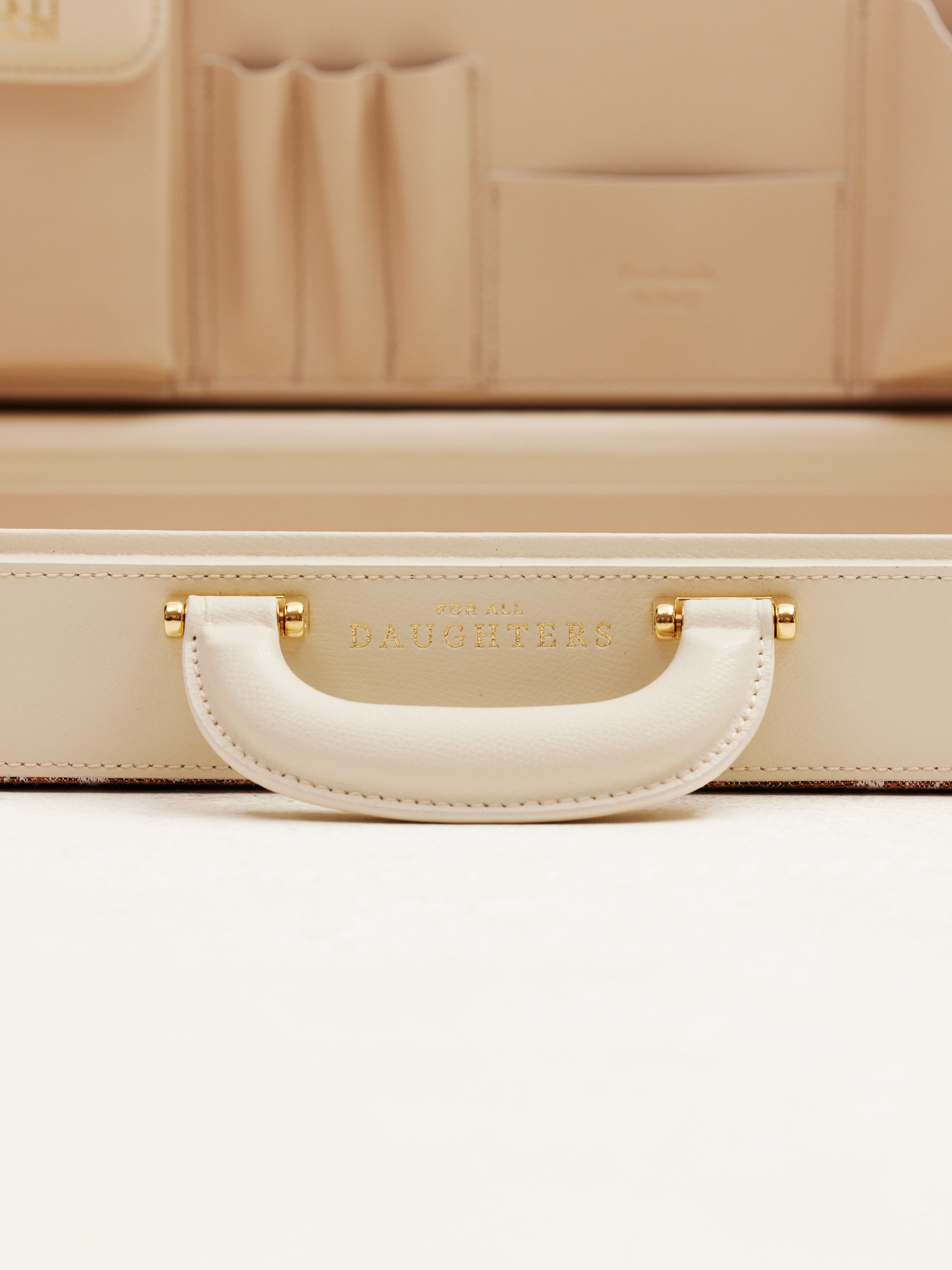 Close up Handle of For All Daughters Latte Heritage Briefcase in leather — handcrafted between Ireland and Italy, a refined luxury gift for modern women